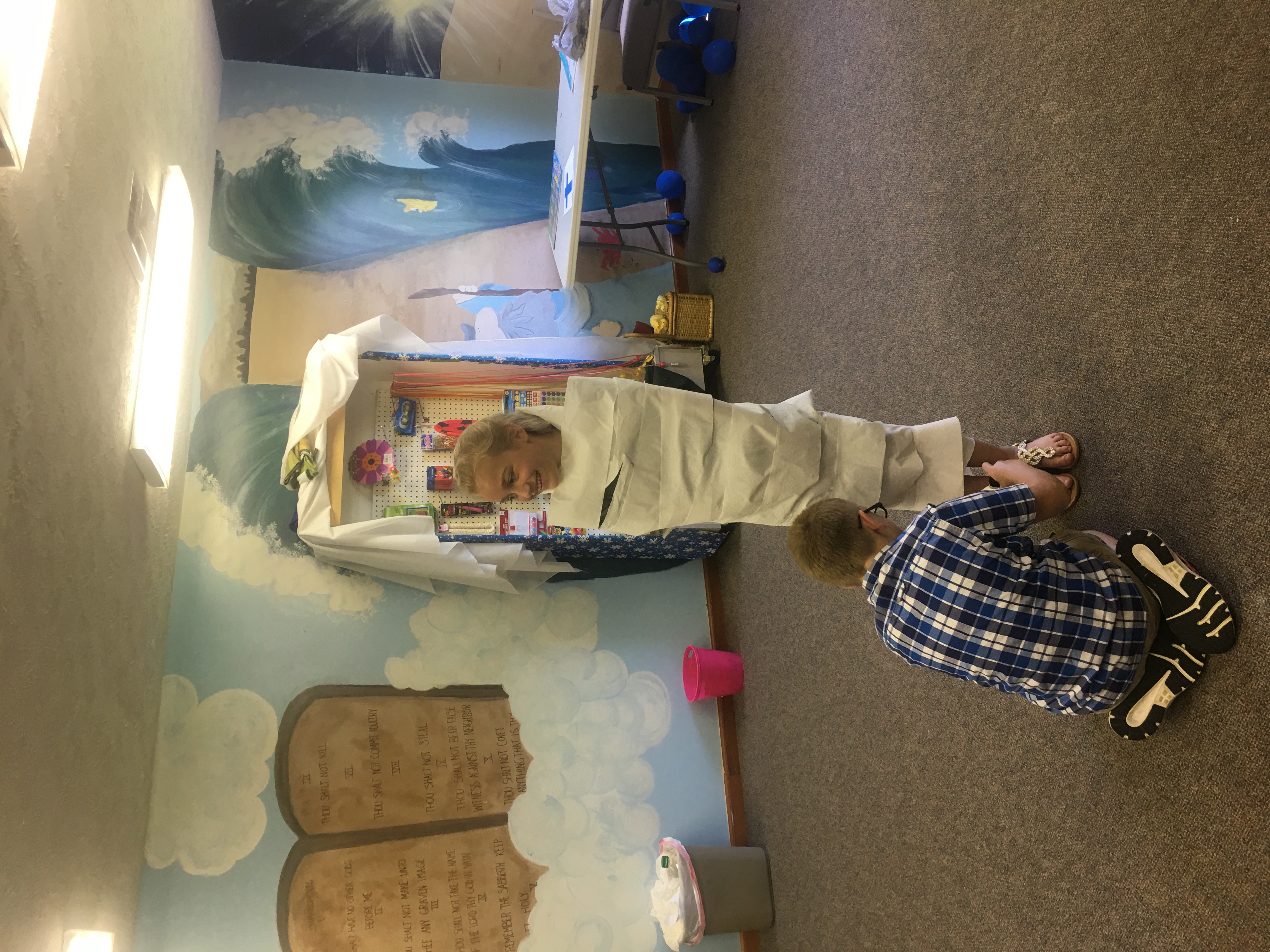 A child participating in a creative Kids Ministry classroom game